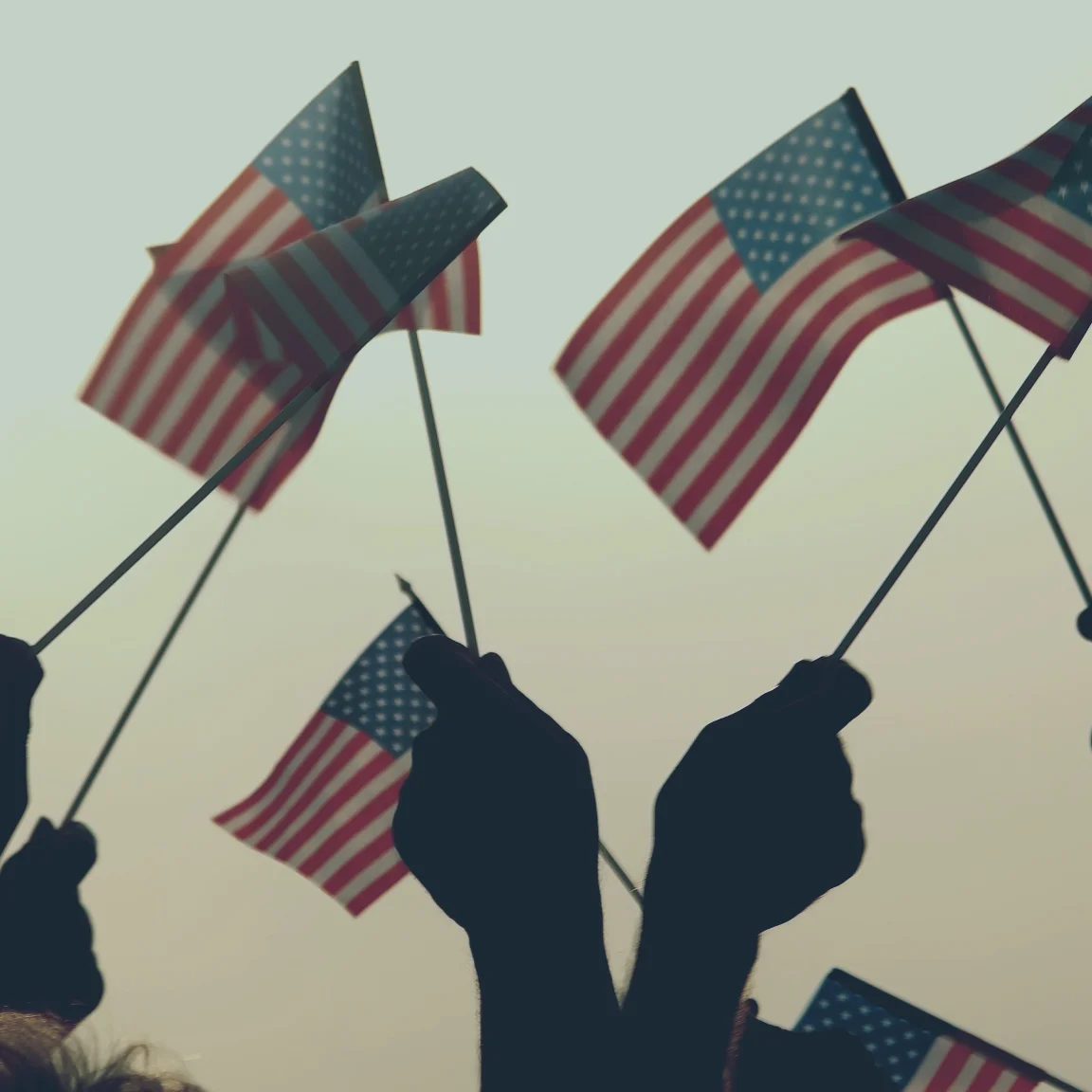 Hands holding American Flag